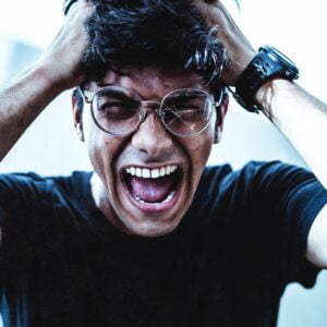 Man In Black Crew Neck T-Shirt Smiling