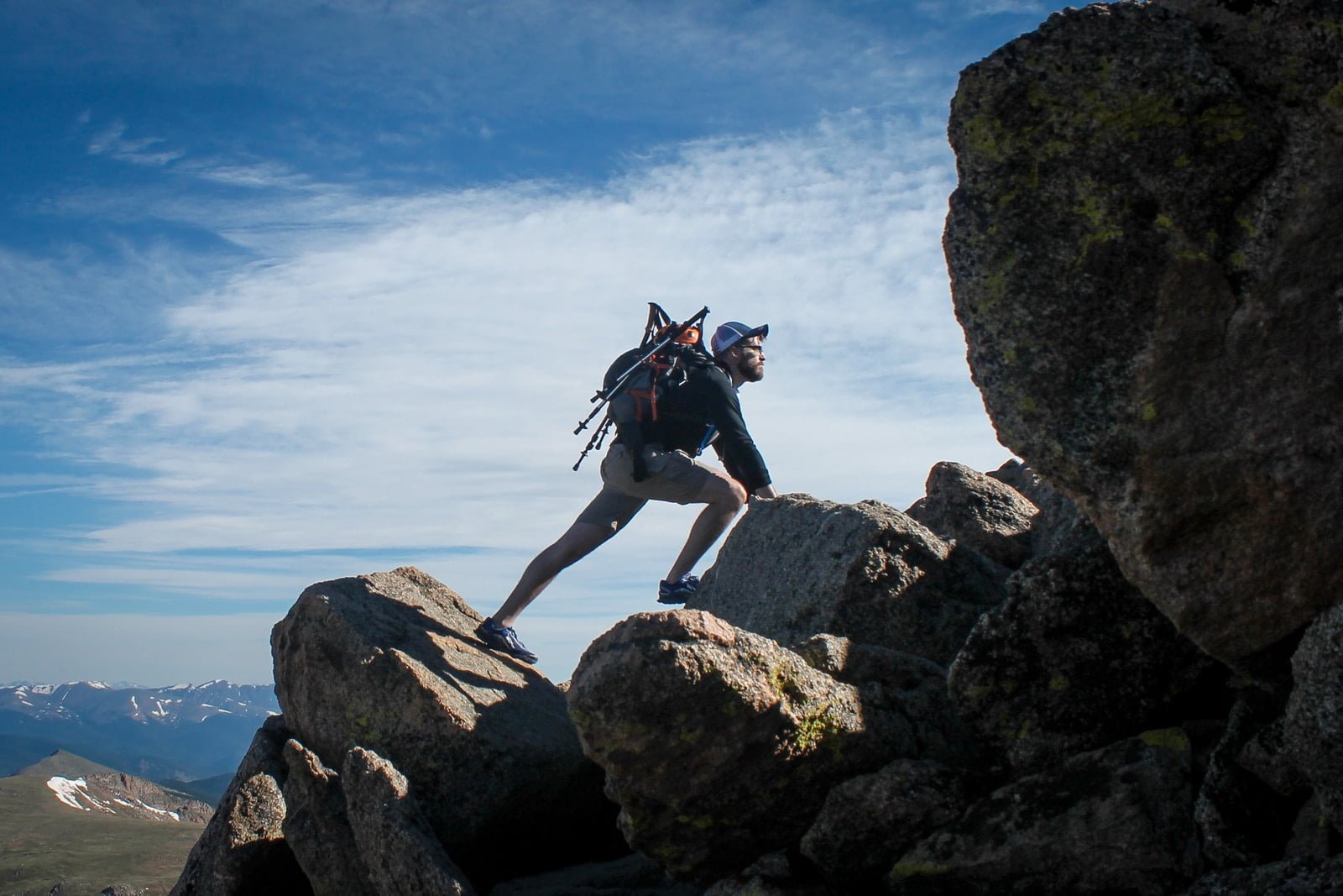 A Man With A Backpack On A Rock, Taking The Next Step In Recovery.